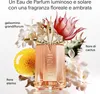 A perfume bottle surrounded by flowers and plants, with descriptive text. Produktbild-Vorschau