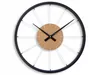 A close-up studio shot of a wall clock. Produktbild-Vorschau