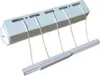A white retractable clothesline mounted on a wall. Anteprima dell’immagine prodotto
