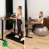 A split image showing a woman using a standing desk with a treadmill and then sitting at the same desk on an exercise ball. Produktbild-Vorschau