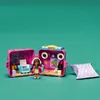 A LEGO Friends Olivia's Game Cube playset is open, showing a mini-doll figure and accessories inside. A purple pillow with question marks is next to it. Náhľad obrázku produktu