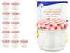 A set of small glass jars with red and white checkered lids, alongside a recipe booklet. Anteprima dell’immagine prodotto