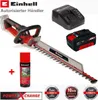 A collage of a hedge trimmer, battery, charger, and spray can, with warranty badges. Produktbild-Vorschau