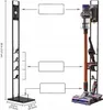Diagram showing dimensions and placement of a vacuum cleaner and its accessories on a stand. Voir les images du produit