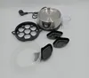 An egg cooker with accessories arranged on a light gray background. Produktbild-Vorschau