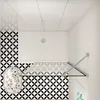 A top-down view of a modern bathroom with a walk-in shower. Produktbild-Vorschau