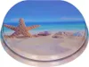 A toilet seat with a beach scene printed on it. Náhled obrázku produktu