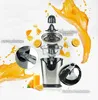 An exploded view of an electric citrus juicer with oranges and juice splashes. Náhled obrázku produktu