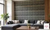 A modern living room with a sectional sofa and a patterned accent wall. Produktbild-Vorschau