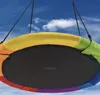 A colorful nest swing hanging against a blue sky with clouds. Produktbild-Vorschau