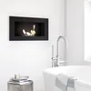 A modern bathroom with a wall-mounted bioethanol fireplace above a bathtub. Náhled obrázku produktu