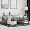 A black metal bed frame with bedding is shown in a bedroom setting. Náhled obrázku produktu