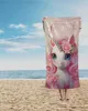 A person is holding a towel with a unicorn design on a beach. Anteprima dell’immagine prodotto