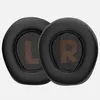 Two black ear pads for headphones, each with an orange 'L' or 'R' marking. Produktbild-Vorschau