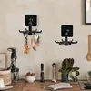 A kitchen counter with two rotating hooks, kitchen appliances, and produce. Produktbild-Vorschau