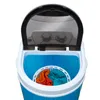 Top view of a portable washing machine with the lid open, showing laundry inside. Produktbild-Vorschau