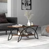 A coffee table is placed in a living room setting, next to a sofa and a patterned ottoman. Anteprima dell’immagine prodotto