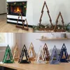 A collage of images showing wooden Christmas trees in different settings and colors. Produktbild-Vorschau