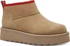 A single tan boot with a red trim and a thick platform sole is shown against a white background.