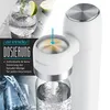 A close-up of a white Arendo soda maker with a blue arrow pointing to the dosing mechanism, alongside a glass of sparkling water and a lime. Produktbild-Vorschau
