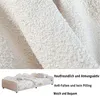 A close-up of a textured fabric and a small sofa bed with bedding. Náhled obrázku produktu