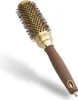 A professional studio shot of a round hairbrush against a white background. Náhled obrázku produktu