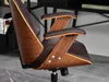 Close-up of a brown office chair with wood accents. Produktbild-Vorschau