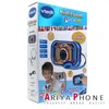 The image shows the retail packaging for a Vtech Kidizoom Touch 5.0 camera, featuring a child holding the camera and highlighting its features. Podgląd zdjęcia produktu