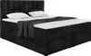 A black upholstered box spring bed with a headboard, two pillows, and a folded blanket. Produktbild-Vorschau