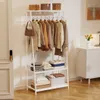 A white garment rack with clothes and storage boxes. Anteprima dell’immagine prodotto
