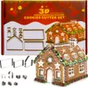 A product shot of a 3D gingerbread house cookie cutter set, displayed on its packaging, with a decorated gingerbread house in the foreground. Náhľad obrázku produktu