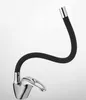 A modern kitchen faucet with a flexible black hose and a chrome base. Produktbild-Vorschau