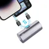 A silver portable charger is shown connected to two phones via USB-C cables, with blue lightning graphics indicating charging. Produktbild-Vorschau