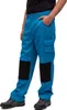 A person wearing blue work pants with black knee patches and grey shoes, standing against a white background. Produktbild-Vorschau