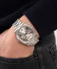 A person wearing a watch and jeans, with their hand in their pocket. Náhled obrázku produktu