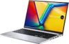 A silver Asus Vivobook laptop is shown from a diagonal angle, open with the screen displaying a colorful abstract image. Produktbild-Vorschau