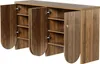 A wooden sideboard with four doors, two of which are open, revealing shelves inside. The sideboard has a vertical ribbed pattern on one of the closed doors and a small gold-colored handle. Podgląd zdjęcia produktu