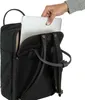 A hand is placing a laptop into a black backpack. Anteprima dell’immagine prodotto