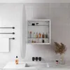 A modern bathroom with a white oval medicine cabinet, a sink, and a towel rack. Podgląd zdjęcia produktu