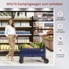 A woman is standing next to a blue camping wagon filled with produce in what appears to be a grocery store or market setting. Produktbild-Vorschau