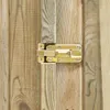 A close-up of a golden latch on a wooden fence. Náhled obrázku produktu