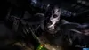 A zombie lunges towards the camera in a dark, gritty environment. Produktbild-Vorschau