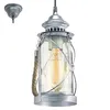 A hanging lantern-style light fixture with a glass shade and a vintage-style bulb. Produktbild-Vorschau