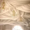 A luxurious interior with draped fabric ceilings and ornate chandeliers. Anteprima dell’immagine prodotto