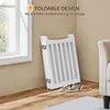 A white foldable pet gate is leaning against a wall next to a window. Two white hangers are on the floor in front of the gate. Podgląd zdjęcia produktu