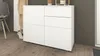 A white chest of drawers with a modern design, placed on a wooden floor next to a wall. Produktbild-Vorschau