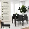 A dining table and chairs set in a modern dining room setting. Náhled obrázku produktu