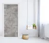 A door with a concrete texture sticker and a small hanging shelf with a plant and a 'Good Morning' sign. Produktbild-Vorschau