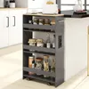 A gray kitchen cart with four shelves filled with jars and bottles, placed next to a kitchen island. Podgląd zdjęcia produktu