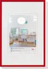 A red picture frame with a white mat, displaying an interior scene. Produktbild-Vorschau
